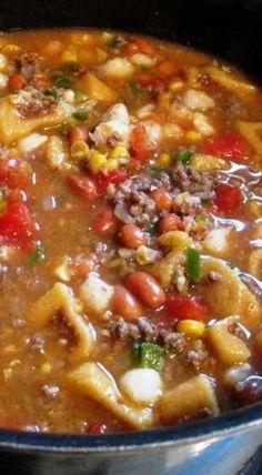 a large pot filled with soup on top of a stove