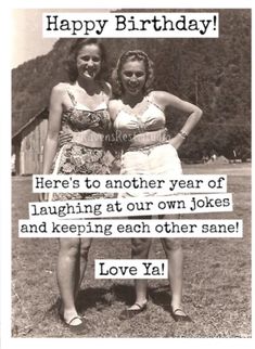 two women standing next to each other in front of a birthday card