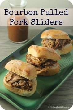 four pulled pork sliders on a green plate