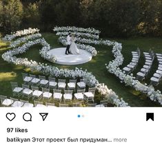 a newly married couple standing in the middle of a circular garden with white chairs and flowers