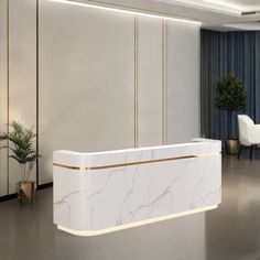 a white marble reception desk in a hotel lobby