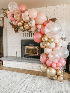 a bunch of balloons that are in front of a fireplace