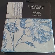 the packaging for lauren's blue and white floral bedding set is on display