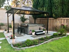 an outdoor hot tub in the middle of a yard