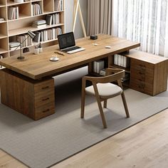 a wooden desk sitting in front of a book shelf filled with books and a laptop computer