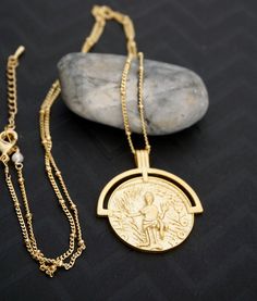 Vintage coin medallion necklace Details: - large gold plated medallion - gold plated satellite chain Dimension: Medallion: 30mm x 35 mm (1.25 inch x 1.5 inch) Chain length : 20 inch + 1 inch extension Cheap Silver Medallion Chain Necklace, Luxury Spiritual Coin Medallion Necklace, Timeless Luxury Gold Medallion Necklace, Luxury Gold Timeless Medallion Necklace, Luxury Amulet Style Medallion Locket Necklace, Affordable Elegant Round Pendant Medallion Necklace, Luxury White Gold Medallion Necklace As Gift, Luxury Timeless Round Medallion Necklace, Gold-tone Medallion Necklace With Coin Pendant