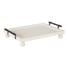 a white and black tray with wheels on the bottom is shown in front of a white background