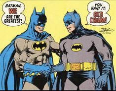 two batmans are standing next to each other