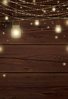 some lights are hanging from strings on a wooden surface with string lights in the background