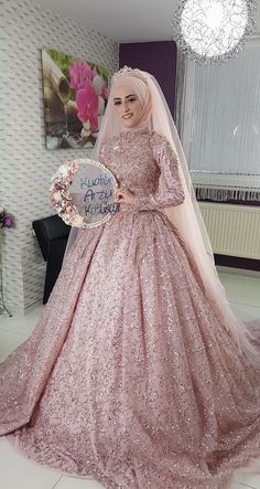 a woman in a pink wedding gown holding a sign