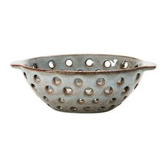 a metal bowl with holes in it