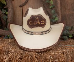 "Turn heads when you wear our beautiful handmade cowboy hat . -SIZE MEDIUM FITS 7 , 7 1/8 , SIZE LARGE 7 1/4 , 7 3/8 -CROWN 4 1/2 \" -BRIM 3 7/8\"" Custom Hat Bands For Rodeo, One Size Fits Most, Western Top Hat For Rodeo, Handmade Southwestern Hats For Ranch, Handmade Hats For Rodeo, Handmade Country Style Top Hat For Country Events, Handmade Western Hat For Western-themed Events, Handmade Western Hat Bands For Western-themed Events, Handmade Country Style Hat Bands For Rodeo, Custom Handmade Top Hat For Rodeo