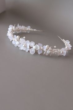 Bride headband, Bridal headpiece floral, Floral bridal tiara, Bridal headband floral, White flower headband, Wedding headband for bride This exquisite wedding blossom headpiece is a perfect choice for a modern bride! It looks great even if you are keeping long curls or straight hair.  The accessory is attached to a silver headband for a secure fit. The flowers are made of UV resin, that is the new trend in handmade jewelry.  Each petal is created manually! - Flexible, easily adjustable, stiff enough to hold your hairstyle all-day - Possible to recreate any size and color  - Suits a range of hairstyles - Comes in a beautiful signature box. Custom orders are welcome! Feel free to contact us!! Please NOTE!! All of our products are handmade, so you can be sure of its non-repeatability!! Rush o White Bridal Headband, Wedding Blossom, Headband For Bride, White Flower Headband, Floral Headband Wedding, Flower Headband Wedding, Bridesmaid Headband, Bride Headband, Headband Bridal