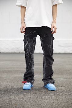 The Raw-Edge Spliced Paint Splatter Flared Jeans are a vintage and avant-garde piece. They feature a washed paint splatter effect on black denim, resembling accidental white paint stains. The spliced design uses two different colors of denim fabric along the seams, enhancing the visual appeal. The jeans have multiple pockets, raw edges, and are made from premium fabric, slightly oversized, perfect for a bold, statement look. Washed paint splatter design Spliced contrasting denim along seams Mult Black Distressed Hip Hop Jeans, Distressed Black Hip Hop Jeans, Black Distressed Jeans Hip Hop Style, Cotton Paint Splatter Jeans For Streetwear, Paint Splatter Cotton Jeans For Streetwear, Casual Paint Splatter Jeans For Streetwear, Spring Streetwear Jeans With Paint Splatter, Acid Wash Grunge Jeans For Streetwear, Casual Cotton Jeans With Paint Splatter