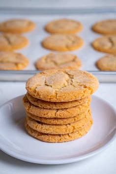 a stack of cookies sitting on top of a white plate