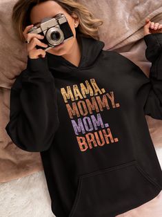 🌟 Calling all moms! Say hello to your new favorite hoodie - the "Mama Mommy Mom Bruh" Heavy Blend Hooded Sweatshirt! 🌟 Are you ready to experience relaxation like never before? Our unisex heavy blend hoodie is the epitome of comfort, crafted with a luxurious blend of cotton and polyester that feels like a warm hug on chilly days. Whether you're running errands, chasing after little ones, or just enjoying some well-deserved me-time, this hoodie is your perfect companion. Featuring a spacious kangaroo pocket in the front, it's not just stylish but practical too - keeping your hands cozy and your essentials close at hand. And let's talk about the hood - with its adjustable drawstring in the same color as the sweater, it adds a touch of flair while offering extra protection against the eleme Cotton Hooded Hoodie For Mother's Day, Mother's Day Hooded Hoodie With Letter Print, Mama Mommy Mom Bruh, Mommy Mom Bruh, Mom Wardrobe, Mom Hoodies, Funny Mom, Comforters Cozy, Mom Humor