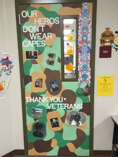 a door decorated with pictures and thank you veterans written on the front, in an office setting