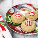 some cookies are on a plate with candy canes