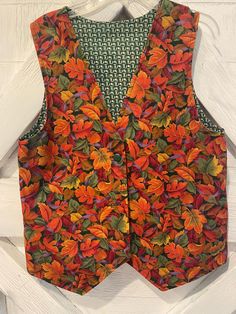 Cute handmade fall vest.  looks to be a size medium large and great vintage condition.  Perfect for the changing weather will be a great layering piece! Brown Cotton Vest For Fall, Retro Cotton Sweater Vest For Fall, Fitted Multicolor Vest For Fall, Multicolor Sleeveless Vest For Fall, Retro Sleeveless Fall Outerwear, Retro Sleeveless Outerwear For Fall, Vintage Sleeveless Sweater Vest For Fall, Vest Looks, Fall Vest