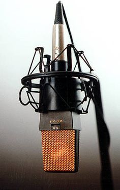 an old fashioned microphone hanging from the ceiling