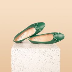 The Como, our new ballerina flat, has a longer toe box and a slim shape that elongate the legs to perfection. The low stacked heel is comfortable for everyday wear, and a cotton bow adds a pretty, feminine touch. Made with premium Italian leather or printed suede Leather lining Lightly padded insole 0.5” leather heel Leather sole with removable plastic Molds with wear Handcrafted in Italy Fit Notes: The Como run true to size, on the narrower side. For wider feet, we suggest going half a size up. Leather Craftsmen, Plastic Molds, Leather Ballet Flats, Ballerina Flats, Chanel Ballet Flats, Stacked Heel, Italian Leather, Leather Heels, Black Suede