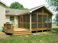 a house with a deck and screened porch