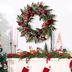 a christmas mantel with stockings and decorations on it