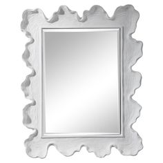 a white framed mirror with scalloped edges