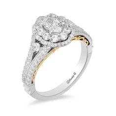 a white and yellow gold engagement ring with an oval center stone surrounded by round diamonds