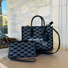 Guaranteed Authentic Brand New With Tags Attached Black Monogram Print Bag For Evening, Black Bags With Monogram Print For Daily Use, Black Monogram Print Evening Bag, Black Monogram Print Bag For Daily Use, Black Michael Kors Purse, Luxury Michael Kors Black Bag, Michael Kors Black Bag With Metal Hardware, Luxury Michael Kors Shoulder Bag For On-the-go, Navy Handbag