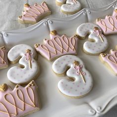 decorated cookies with pink and white frosting are arranged on a platter that says 30th