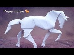 an origami horse standing on its hind legs