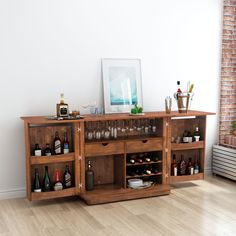 a wooden cabinet filled with bottles and glasses