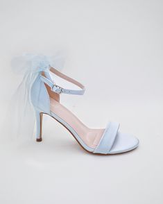 Classic satin high heel sandals adorned with tulle bow and ankle strap for romantic, elegant and feminine look. The light blue color can easily be your something blue. Simple and easy wear for bridal wear, bridesmaids, holiday party, wedding parties, and any special occasions. DETAILS:HEEL HEIGHT: 3.5 InchesUPPER: Synthetic upper and liningMATERIALS: Manmade outsoleORIGIN: Imported Open Toe Bridesmaid Wedding Shoes With Bow, Bridesmaid Open Toe Wedding Shoes With Bow, High Heel Sandals With Satin Bow For Wedding, Wedding Heels With Satin Bow Open Heel, Wedding Heels With Satin Bow And Open Heel, Wedding Heels With Satin Bow, Wedding Sandals With Satin Bow And Open Heel, Open Toe Heels With Satin Bow For Bridesmaids, Summer Wedding Shoes With Satin Bow For Bridesmaid