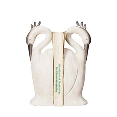 a bookend with two white swans on it