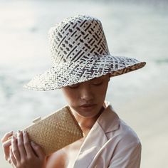 Handmade wide round straw hat made of Lontar straw by artisans in Borneo. Each Lontar straws were dyed manually with natural ink materials. Its flexible structure helps this hat to fit comfortably, but still manage its beautiful sturdy shape. Dimension: around 13 inches Head Measurement diameter: around 7 inches