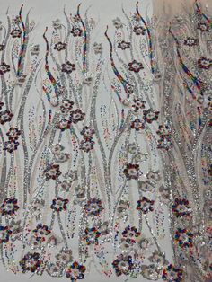 This high quality Fabric is measured in 5 Yards With Embroidered Beading and Sequin. It is soft, very delicate and beautiful. This high Quality Fabric is made with Fashion embroidered rhinestones can be used in making party wedding dresses, skirts, shawls, scarves and other other fashion apparels as you would like. Size : Length : 5 yards (180 inch). Width: 50 inch (Please allow slight deviation for the measurement data ,±1 inch) Material: 100% Polyester, Tulle Lace Fabric, Eco-Friendly embroide Multicolor Embroidered Sequin Wedding Dress, Wedding Dress With Multicolor Embroidery And Sequins, Party Lace Fabric With Rhinestones Embroidery, Multicolor Sequined Embroidered Fabric For Wedding, Multicolor Sequined Embroidery Fabric For Wedding, Multicolor Embroidered Sequin Fabric For Wedding, Embellished Multicolor Embroidered Fabric For Wedding, White Sequin Fabric With Floral Embroidery For Party, Wedding Embroidered Fabric With Sequins In Multicolor