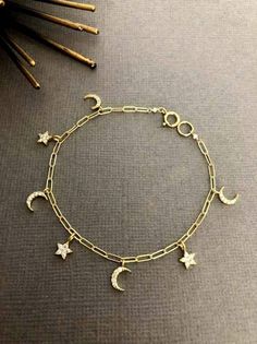 "Crescent Moon and star bracelet, birthday gift, Paper, Dainty Moon bracelet, Gift for her, Moon and star charm bracelet The word \"crescent\" comes from the Latin word \"crescere,\" meaning to grow. We are always learning and growing as people, and this elegant, Charm embodies the strong symbolism of the ever-changing moon. --------------------------------------------------------------------- ** DETAILS ** - 7 Moon and Star charms Up to 6.5\" long bracelet - 8 Moon and Star charms for  7\" and 7.5\" -9 Moon and Star charms for 8\" and 8.5\" - 10 Moon and Star charms for 9\" and 9.5\" ---------------------------------------------------------------------- ** FEATURES ** - 18K Gold Vermeil Paperclip Chain - Gold filled Clasp - Cubic Zirconia - Gold Plated over Brass moon and star charms ---- Celestial Charm Bracelet With Moon Charm As A Gift, Celestial Moon Charm Bracelet As Gift, Celestial Moon Charm Bracelet For Gift, Celestial Charm Bracelet With Star Charm As Gift, Celestial Star Charm Bracelet Gift, Moon And Star Bracelet, Star Charm Bracelet, Learning And Growing, Crescent Moon And Star