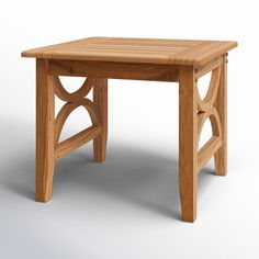 a small wooden table sitting on top of a white floor