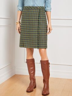 For work and beyond. A wrap-inspired silhouette defines our A-line style skirt. In a charming plaid pattern with on-trend fringe detail at the front. Features A-Line Hits Above Knee Concealed side zip closure Lined Imported Fit: Misses: 20 1/2"; Petite: 19 1/2"; Plus: 22 1/2"; Plus Petite: 20 1/2" Material: Shell: 48% Wool, 27% Polyester, 25% Viscose; Lining: 100% Polyester Care: Machine Wash Cold; Only Non-Chlorine Bleach When Needed; Turn Garment Inside Out; Line Dry; Cool Iron, If Needed | Fr Talbots Outfits, Wool Plaid Skirt, Red Plaid Skirt, Tweed Pencil Skirt, Knee Length Skirt Pencil, Printed Pleated Skirt, Work Clothing, Wrap Maxi Skirt, Wool Pencil Skirt