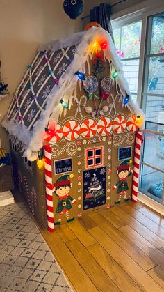 a gingerbread house decorated with lights and decorations