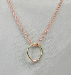 "Drop of Copper on a brass circle, Simple and Delicate Necklace. - Your choice of High quality USA made sterling silver, Copper, 14k Gold Filled, or 14k Rose Gold Filled chain - Each dew drop pendant is made by hand, and different. - Mixed metals and longer chain available, convo me! - Comes in a cute package ready for gifting (see last photo). - Made to order, just for you. I offer this necklace in other metals: - Pure Copper: - 14k Gold Filled with 14k Gold Drop: - 14K Rose Gold Filled with 14 Rose Gold Brass Charm Necklace With Round Pendant, Hand Forged Rose Gold Round Jewelry, Hand Forged Rose Gold Jewelry, Hand Forged Round Rose Gold Jewelry, Gold Oval Copper Necklace, Minimalist Gold Copper Jewelry, Rose Gold Circle Necklace In Sterling Silver, Rose Gold Sterling Silver Circle Necklace, Rose Gold Circle Sterling Silver Necklace