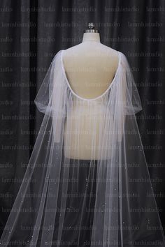 a mannequin with a veil on top of it