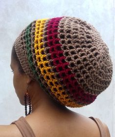 a woman wearing a multicolored crocheted hat