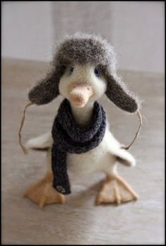 a stuffed animal with a scarf around it's neck