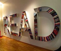 the letters are made out of books on the wall