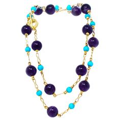 A signed Rosaria Varra long station necklace featuring alternated natural turquoise round beads measuring 8-9mm and amethyst round beads measuring 16mm, set in 18k yellow gold with a 0.54 carat of GH color and VS-SI clarity diamond clasp made into a toggle fashion. This beautiful 36” long station necklace with turquoise and amethyst beads can also be worn as double strands and is guaranteed to enhance any outfit on any occasion. The total weight of the necklace is 124.6 grams. Antique Turquoise Jewelry, Matte Gold Necklace, Sapphire Diamond Necklace, 1st Dibs, Antique Turquoise, Blue Sapphire Diamond, Natural Gold, Amethyst Beads, Station Necklace