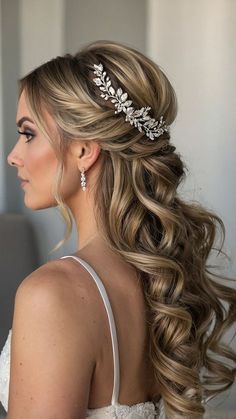 a woman with long hair wearing a wedding hairstyle