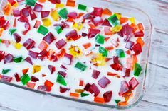 a glass dish filled with colorful jello and marshmallows