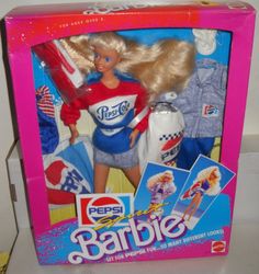 a barbie doll in a pink box with clothes on the back and an american flag